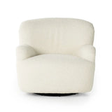 A beige upholstered Kadon swivel chair with a high wing back and softly rolled arms, standing on a white background.