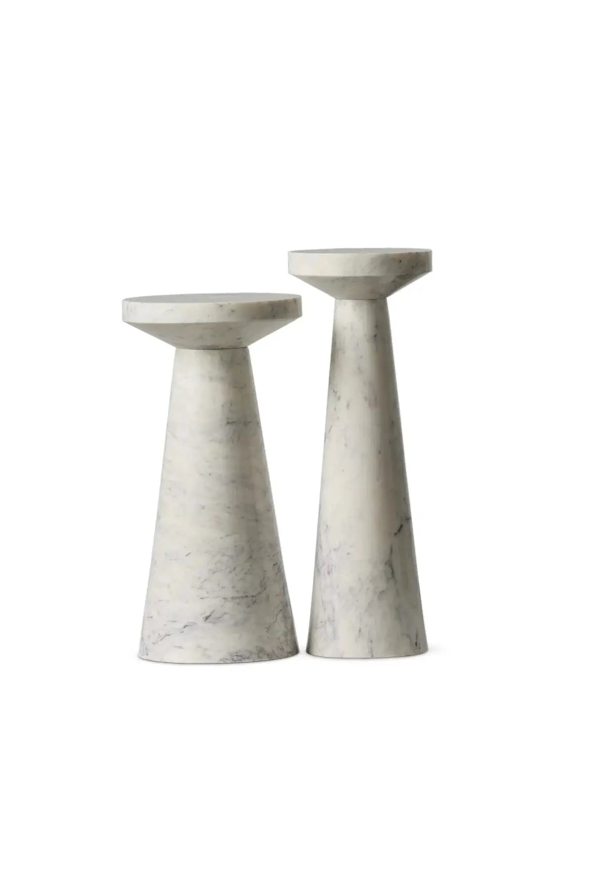 A set of two marble nesting end tables made of veined white marble with staggered heights.