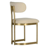 Art Deco mid-century modern chair with gold frame and beige cushion on a white background