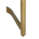 Close-up of a gold metal leg on the Shay Dining Chair on a white background