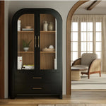 Black arched cabinet with glass doors in a living room setting