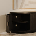 Dark wooden contemporary tv stand with two shelves in a room with an abstract painting on the wall.