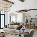 Modern living room with neutral tones and wooden beams with the Kadon Swivel chair