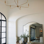 nottaway large modern chandelier for high ceilings in an entry way hall with a bench and large mirror