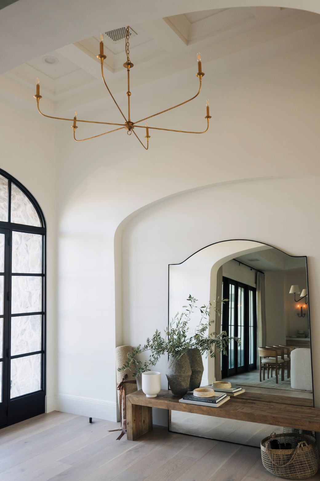 nottaway large modern chandelier for high ceilings in an entry way hall with a bench and large mirror
