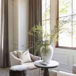 custom upholstered ottoman with fringe detail in a luxury home in Arizona