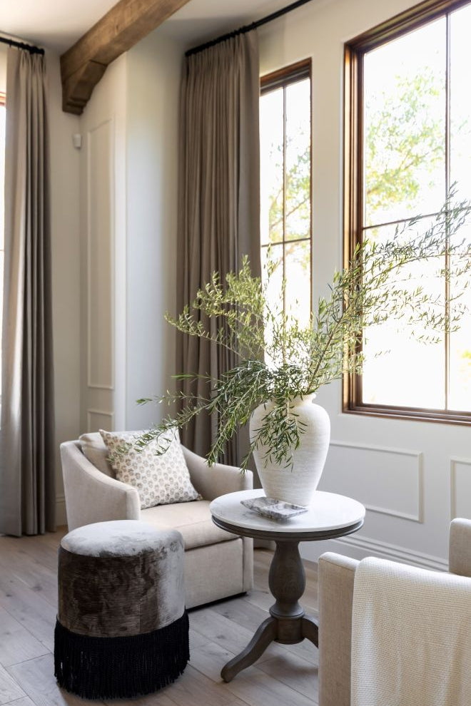 custom upholstered ottoman with fringe detail in a luxury home in Arizona