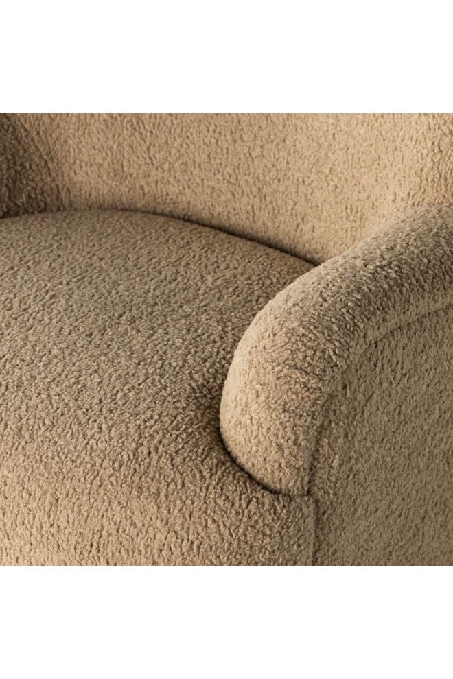 Close-up of a textured beige  upholstered seating on a white background